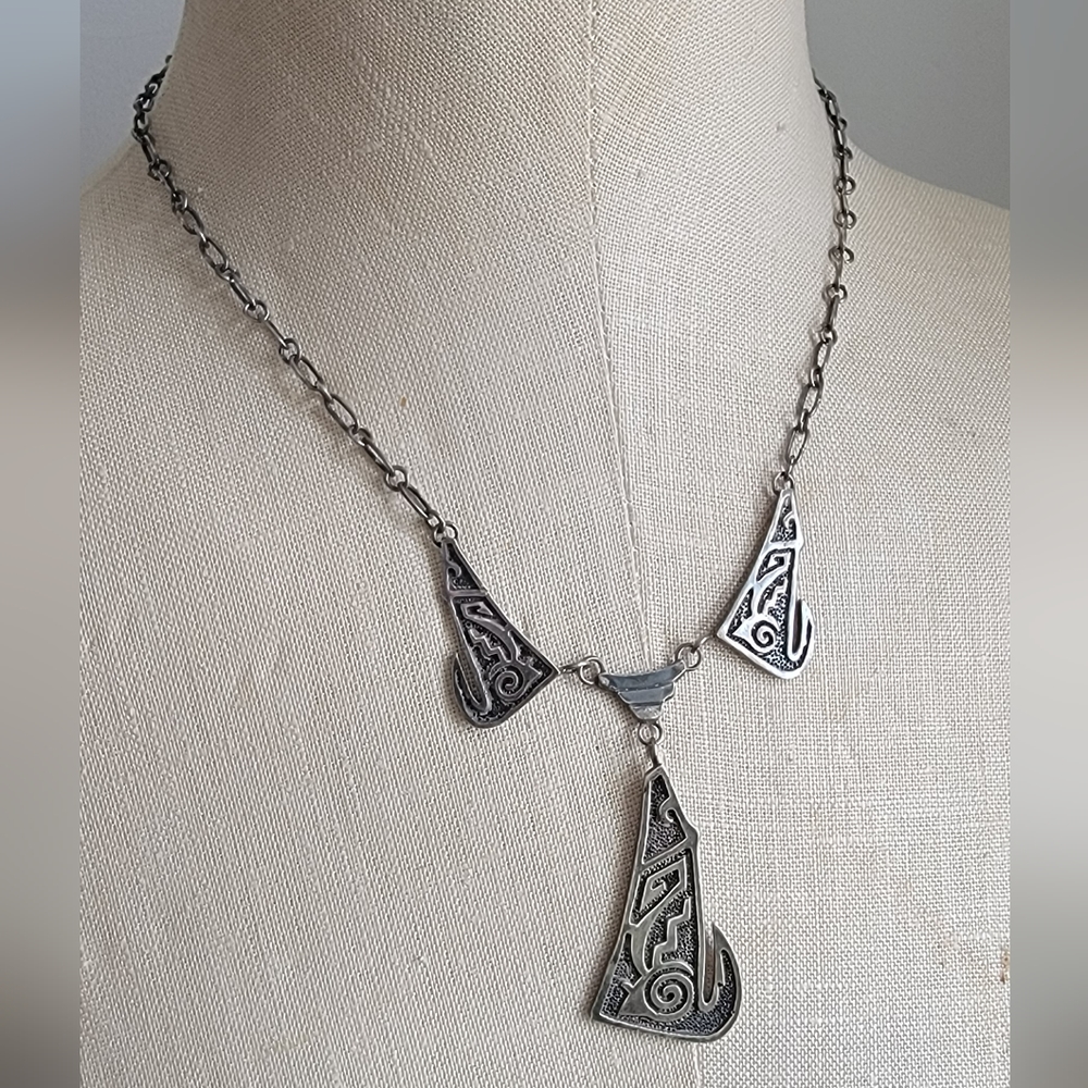 Vintage sterling silver Navajo necklace with 3 coyotes. Marked EB